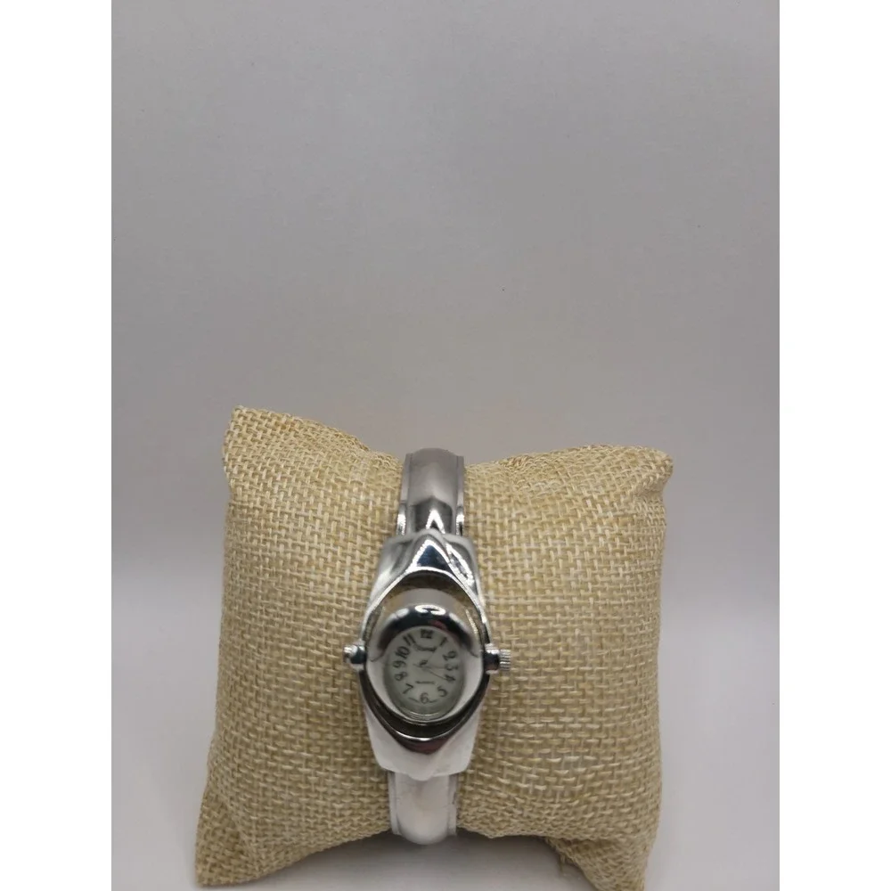 Xanadu Women's Silver Tone Hinged Cuff Bangle Quartz Watch Oval Dial Reverse
